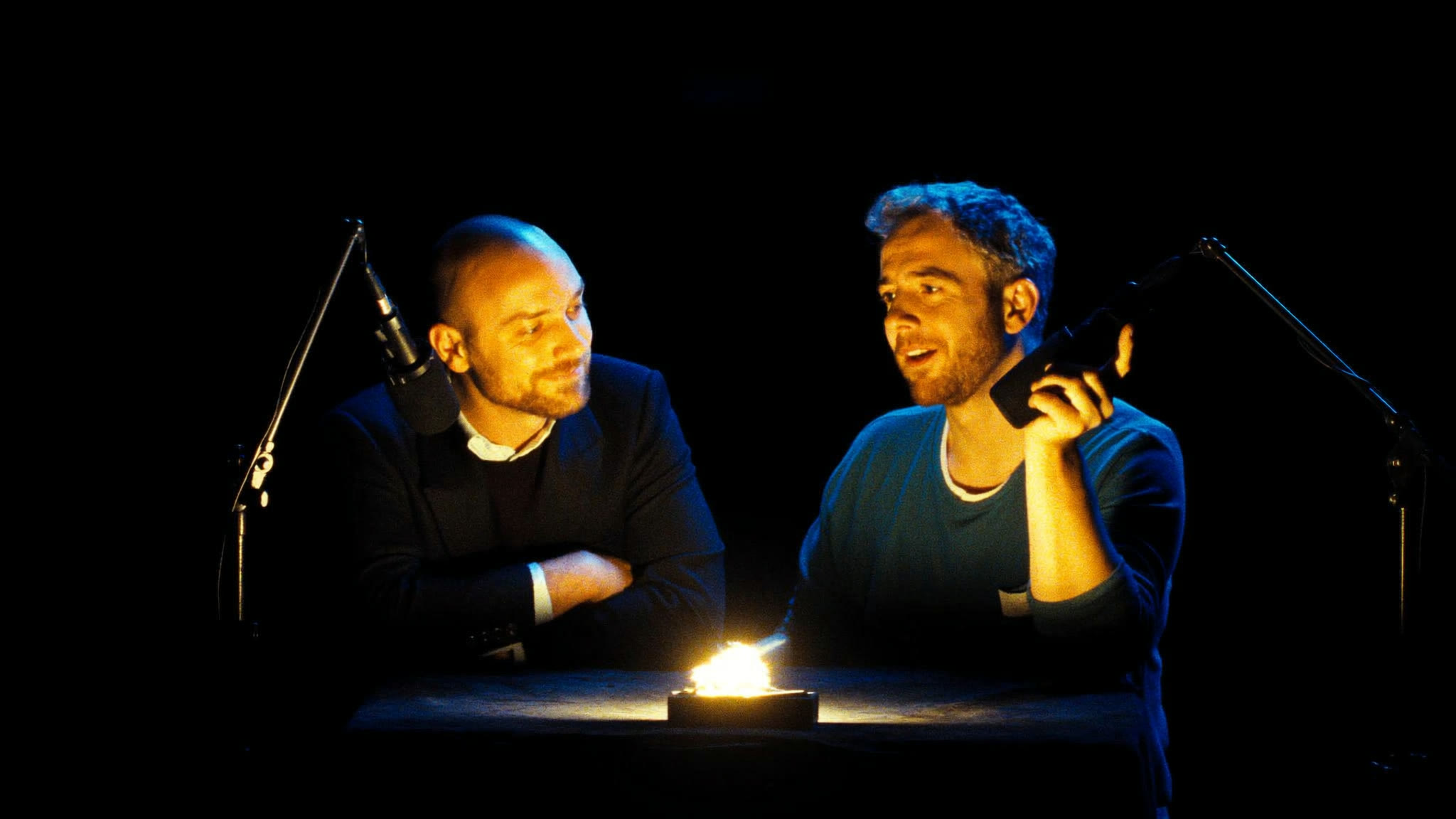 Two people recording a podcast
